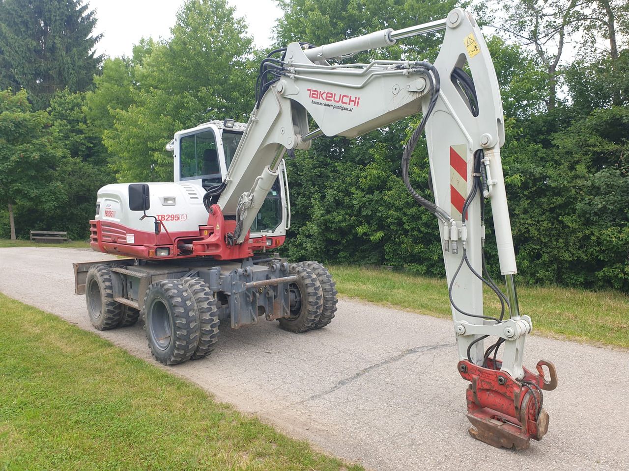2013 Takeuchi TB295W wheel excavator, rear three-quarter view 2013 Takeuchi TB295W wheel excavator, rear three-quarter view