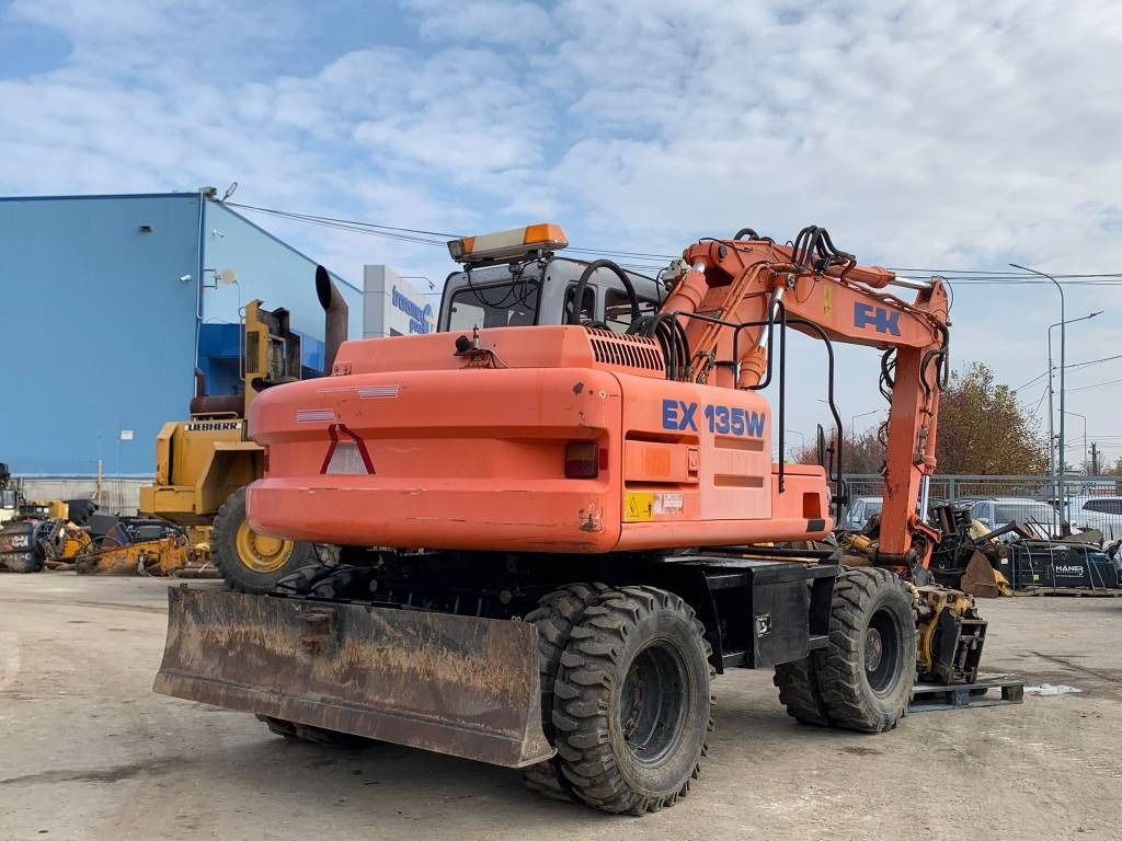 2003 Fiat-Kobelco EX135W wheel excavator, rear three-quarter view