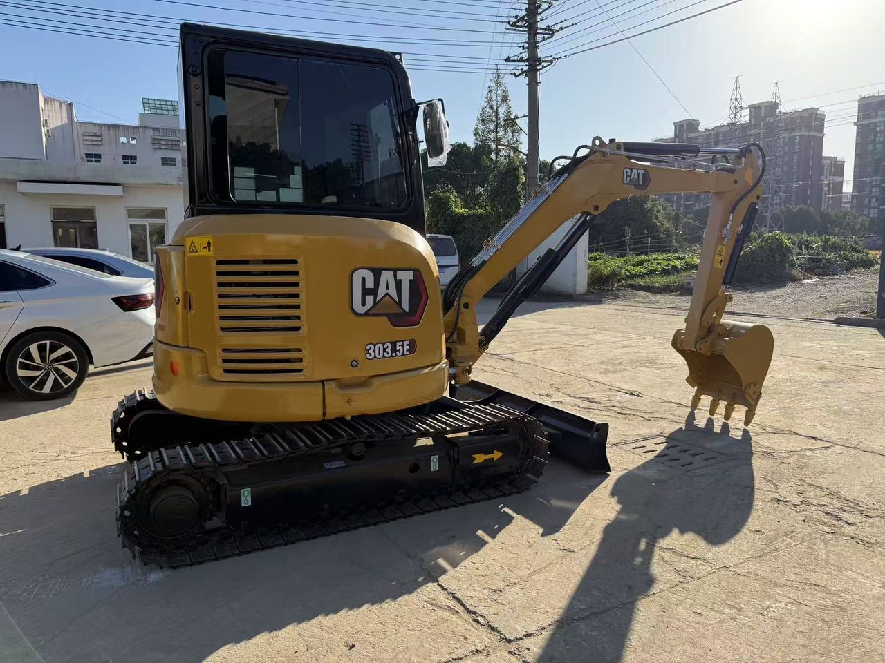 2021 Caterpillar 303.5E mini excavator, rear three-quarter view