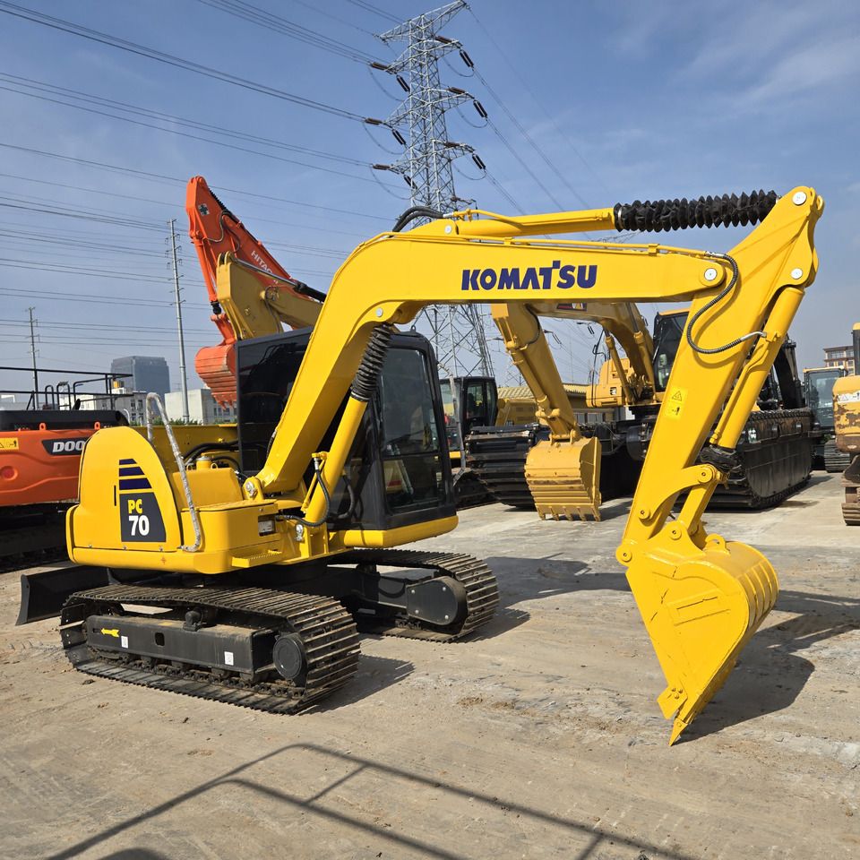 Komatsu PC70-8 mini excavator, side profile view Komatsu PC70-8 mini excavator, side profile view