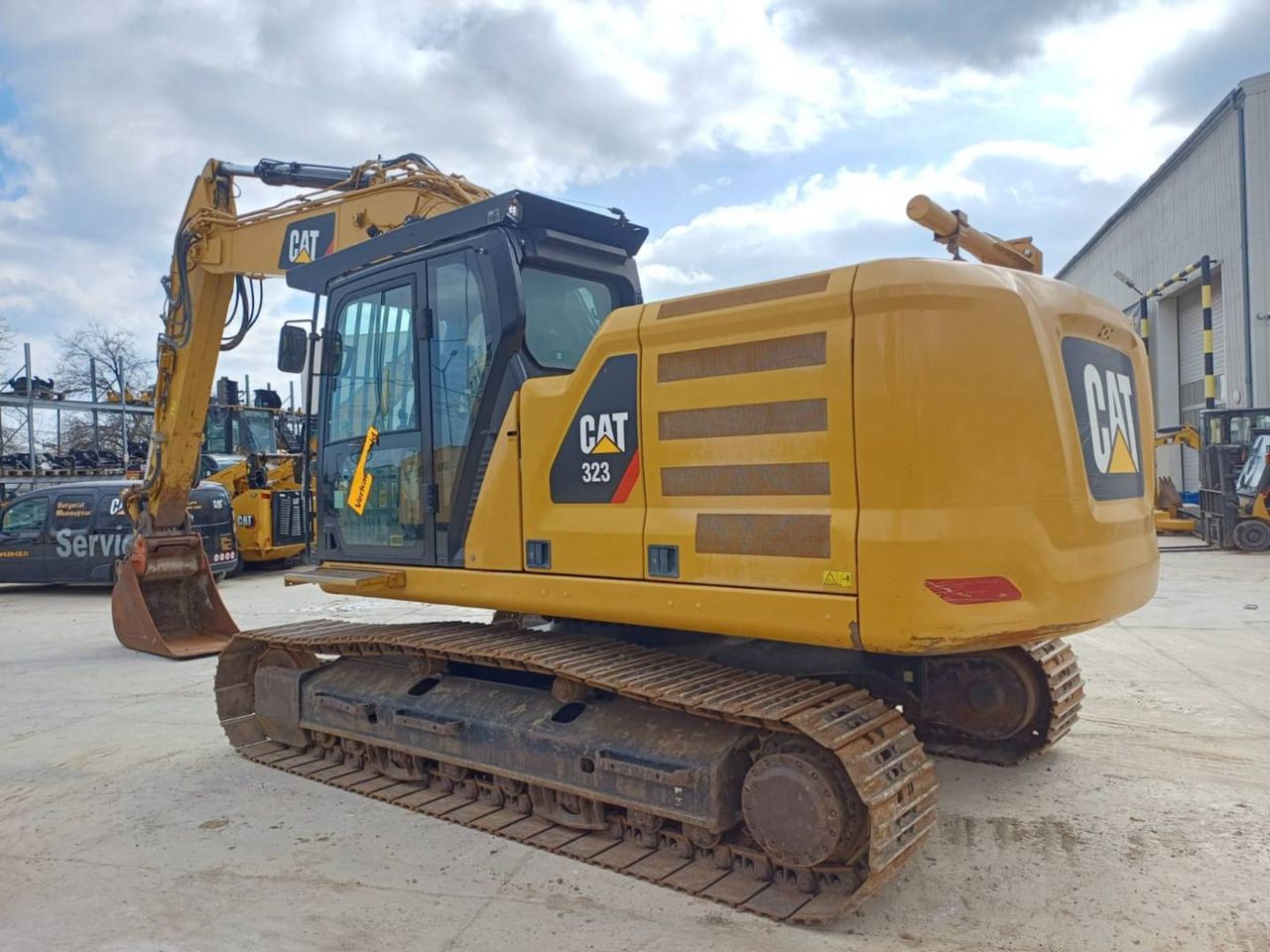 2018 Caterpillar 323 crawler excavator, rear three-quarter view 2018 Caterpillar 323 crawler excavator, rear three-quarter view