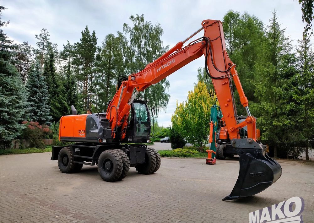 2012 Hitachi Zaxis 140W wheel excavator, side profile view