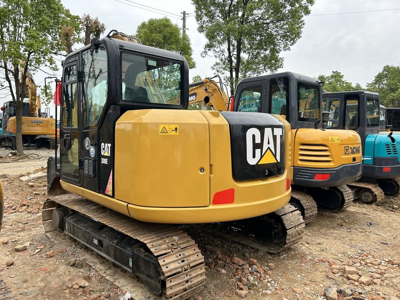 2019 Caterpillar 308E mini excavator, rear three-quarter view 2019 Caterpillar 308E mini excavator, rear three-quarter view