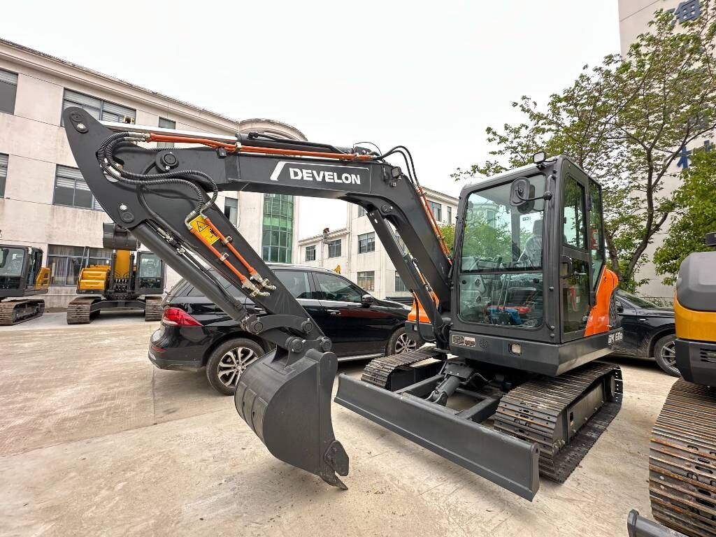 2026 Develon DX60D-10 mini excavator, front three-quarter view 2026 Develon DX60D-10 mini excavator, front three-quarter view