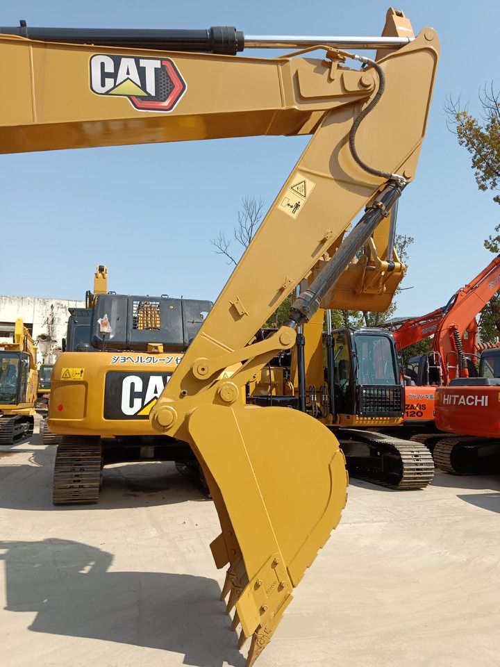 2023 Caterpillar 320GC crawler excavator, close-up of boom and bucket