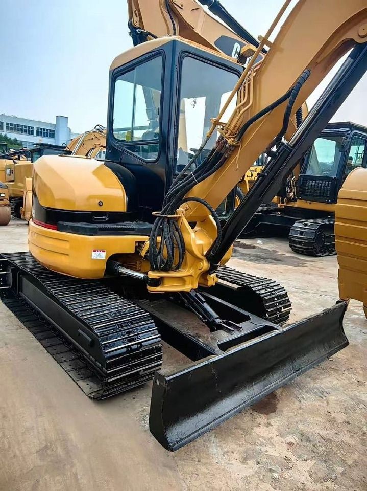 2024 Caterpillar 304 mini excavator, front three-quarter view 2024 Caterpillar 304 mini excavator, front three-quarter view