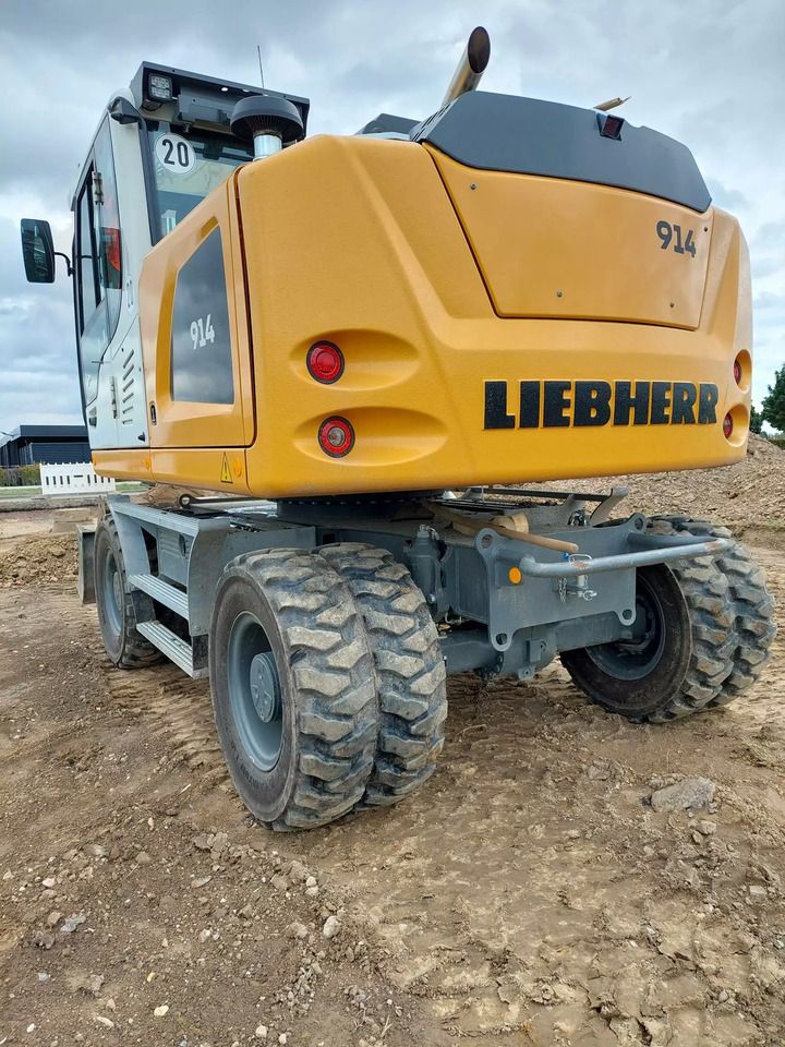 2023 Liebherr A914 Litronic wheel excavator rear three-quarter view 2023 Liebherr A914 Litronic wheel excavator rear three-quarter view