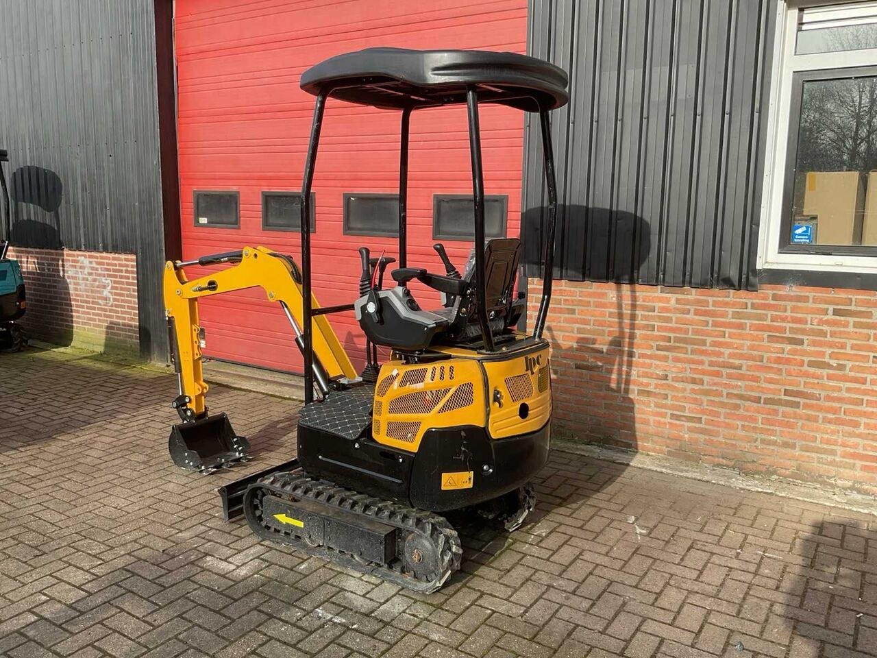 JPC KV15 mini excavator, rear three-quarter view