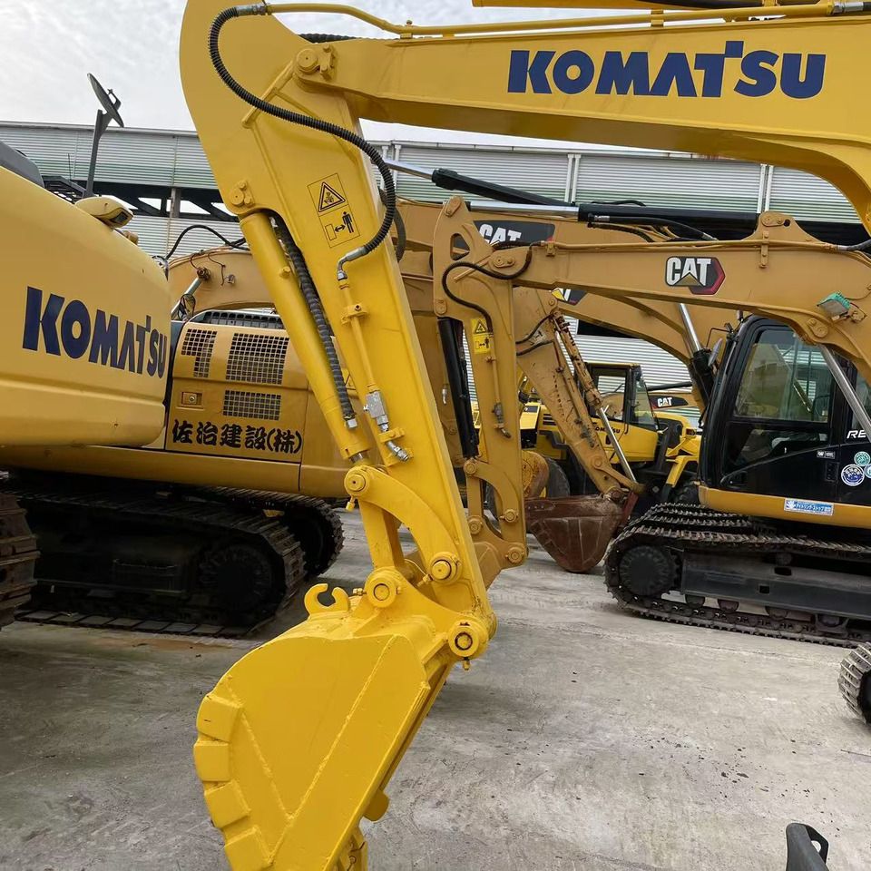 2023 Komatsu PC56-7 mini excavator, side view of boom and bucket 2023 Komatsu PC56-7 mini excavator, side view of boom and bucket