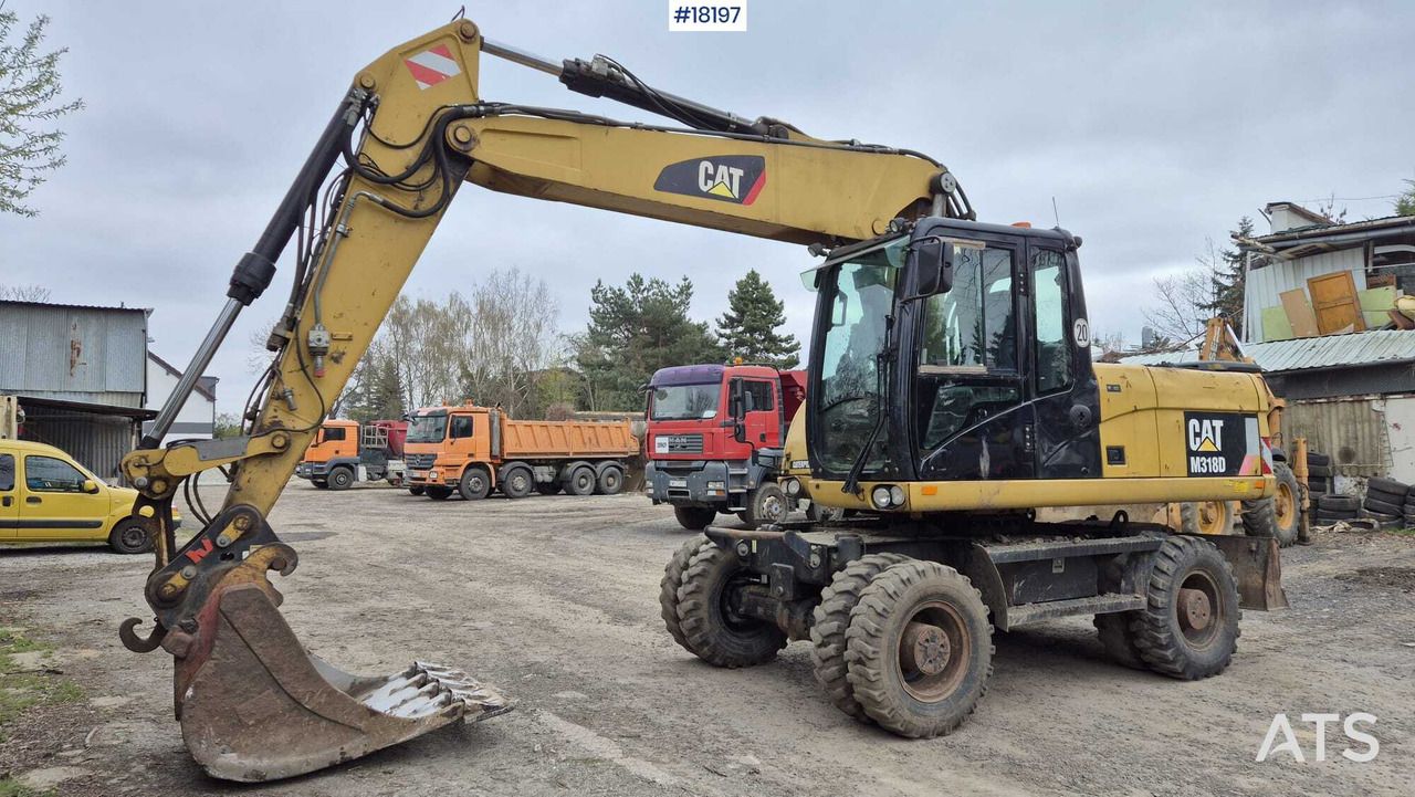2010 Caterpillar M318D wheel excavator, side view 2010 Caterpillar M318D wheel excavator, side view