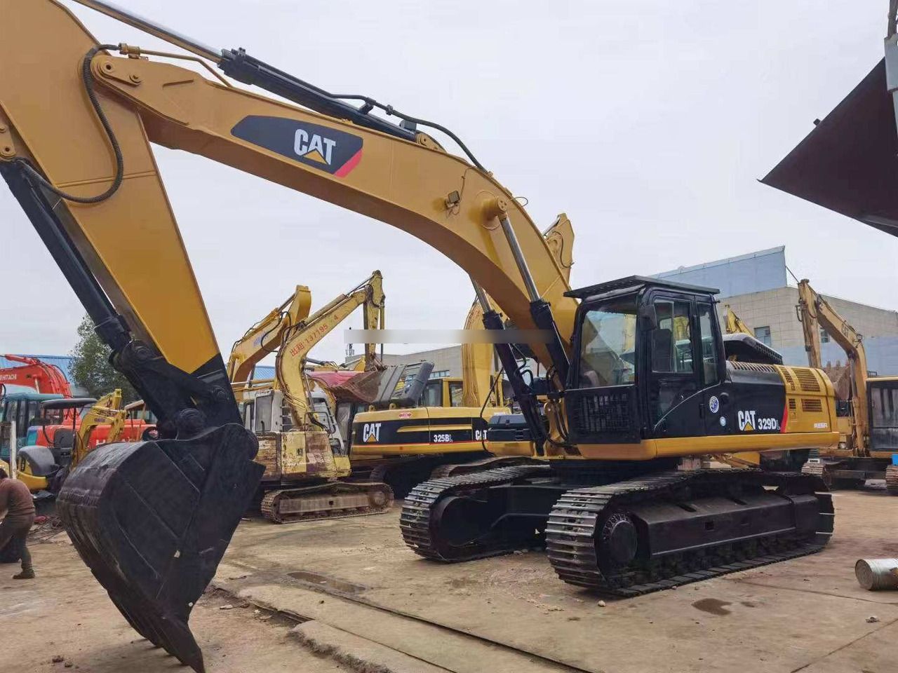 2011 Caterpillar 329DL crawler excavator, front three-quarter view 2011 Caterpillar 329DL crawler excavator, front three-quarter view