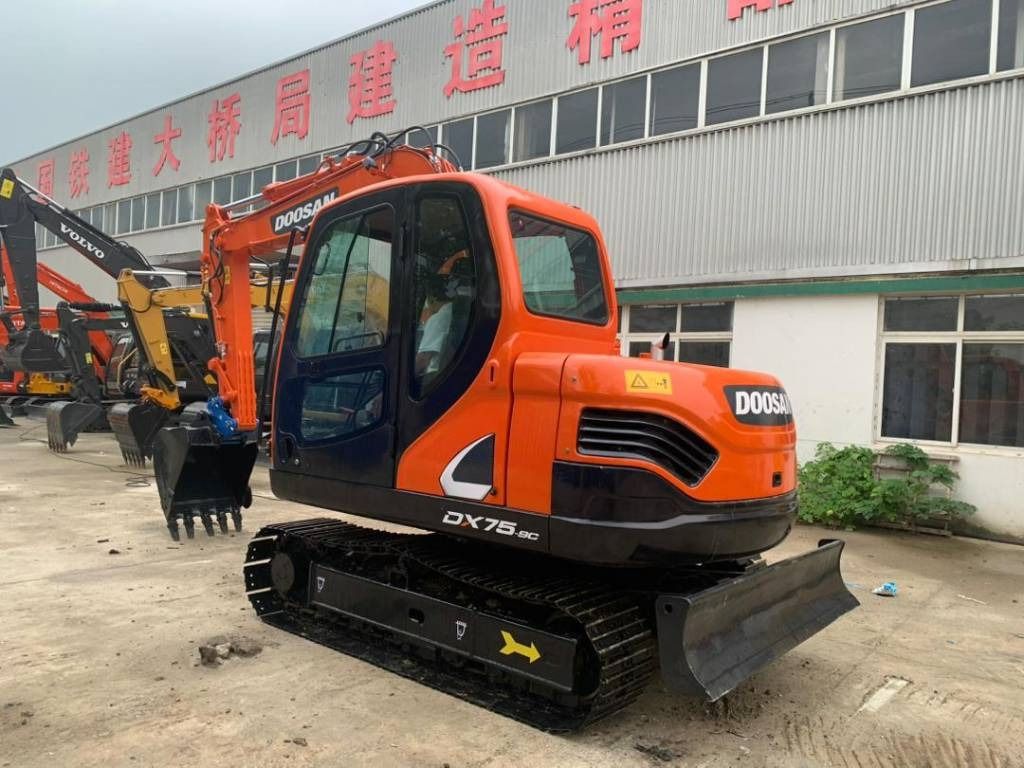 2023 Doosan DX75-9C mini excavator, rear three-quarter view 2023 Doosan DX75-9C mini excavator, rear three-quarter view