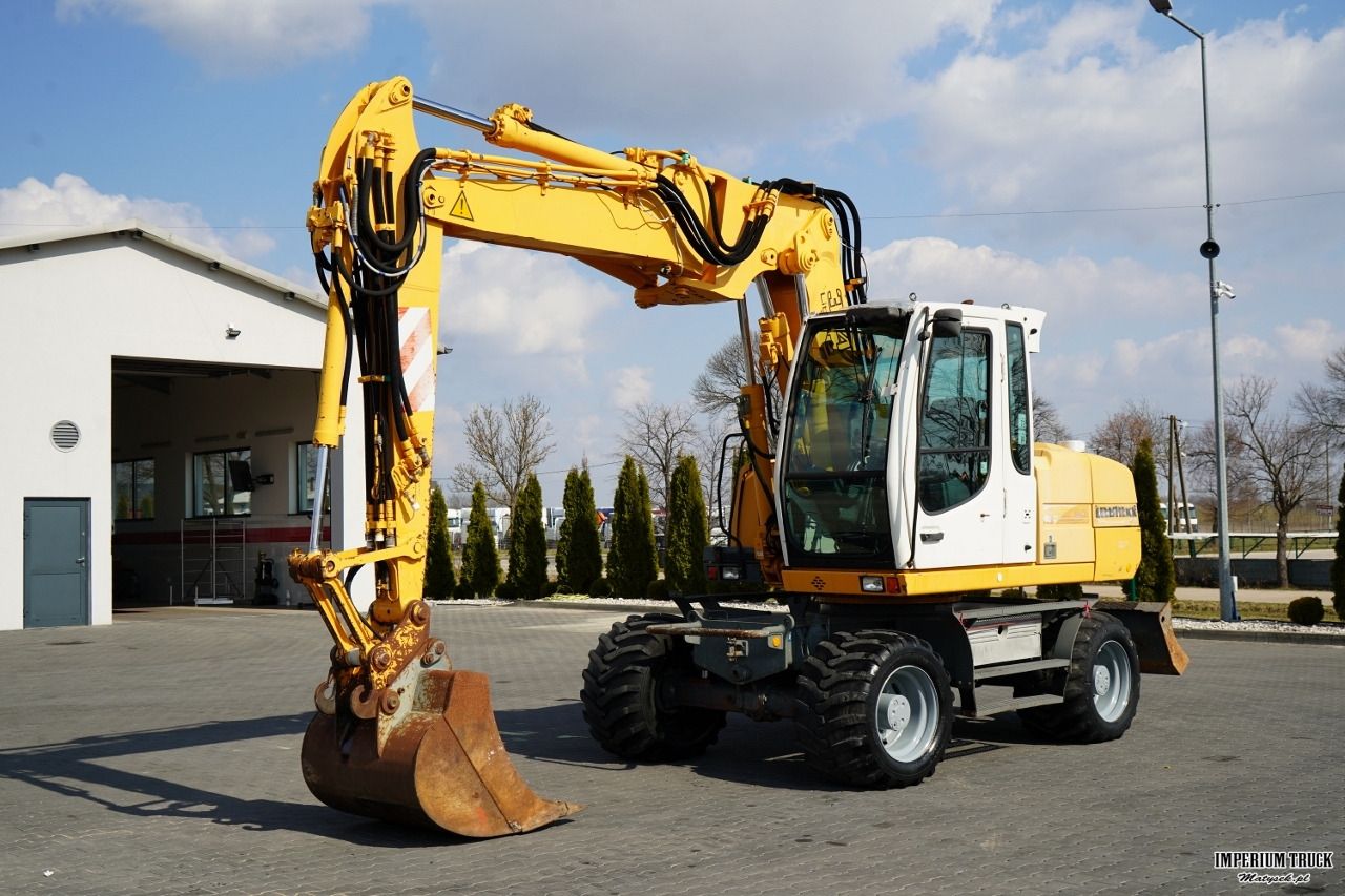 2001 Liebherr A314 LITRONIC wheel excavator, front three-quarter view 2001 Liebherr A314 LITRONIC wheel excavator, front three-quarter view