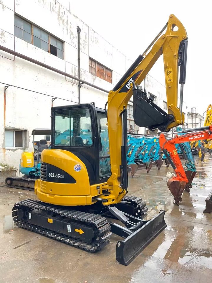 2023 Caterpillar 303.5 C CR mini excavator, rear three-quarter view