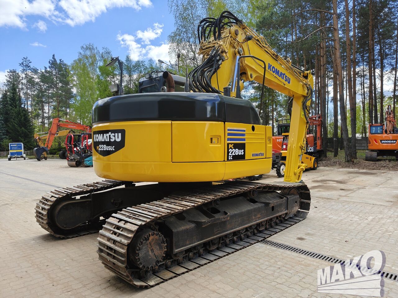 2010 Komatsu PC228USLC-3 crawler excavator, rear three-quarter view 2010 Komatsu PC228USLC-3 crawler excavator, rear three-quarter view