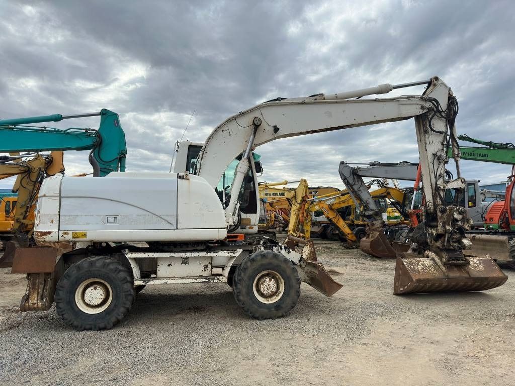 2009 Caterpillar M316D wheel excavator side view 2009 Caterpillar M316D wheel excavator side view