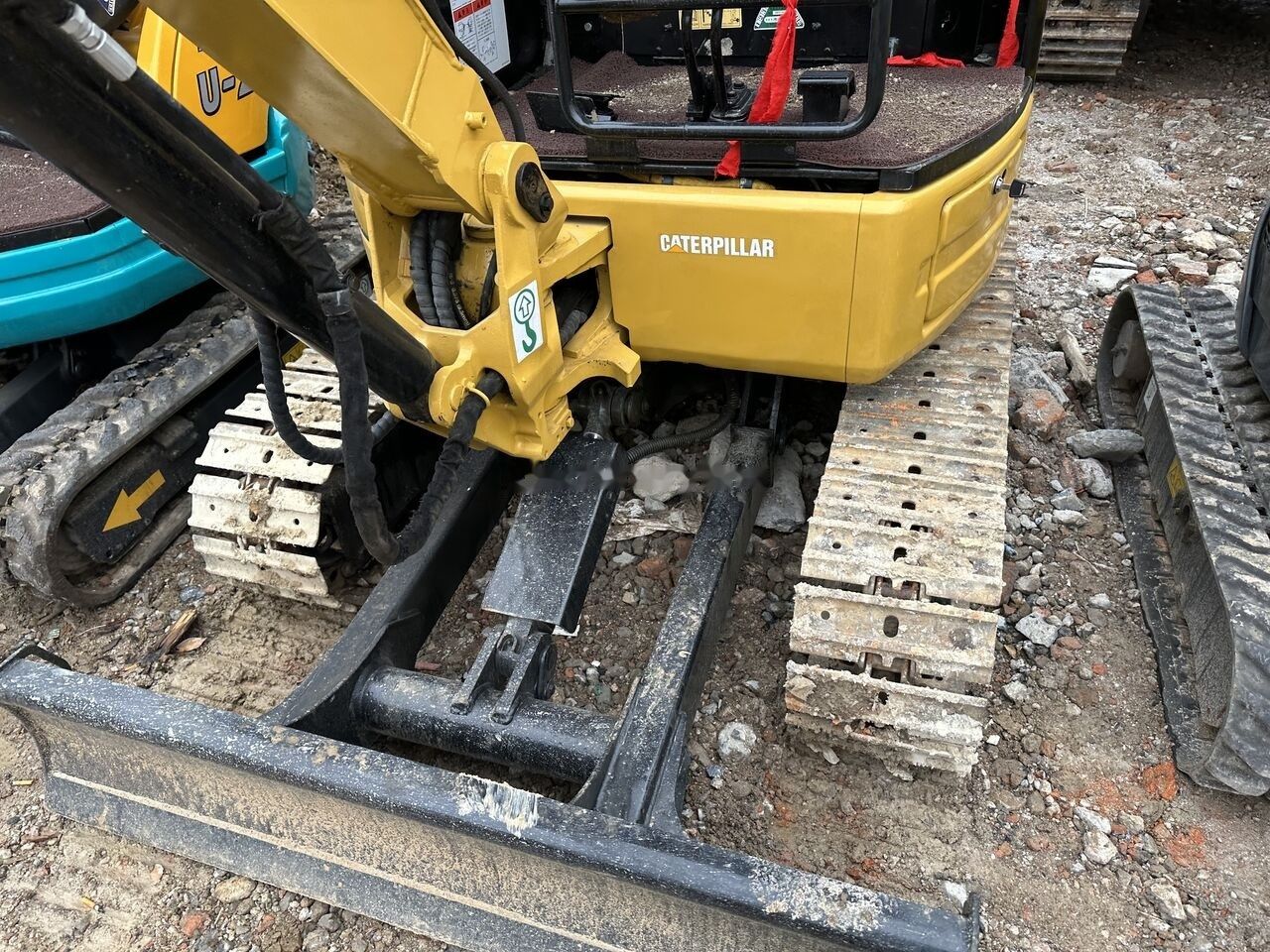 Caterpillar 303E mini excavator front view Caterpillar 303E mini excavator front view