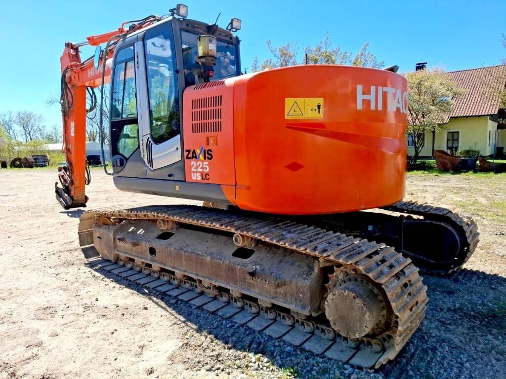 2009 Hitachi ZX225USLC-3 crawler excavator, rear three-quarter view 2009 Hitachi ZX225USLC-3 crawler excavator, rear three-quarter view