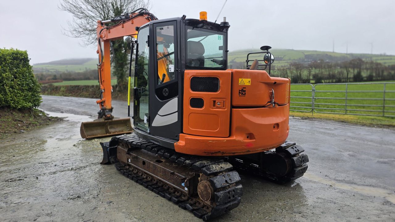 2022 Hitachi ZX85USB-6 mini excavator, rear three-quarter view 2022 Hitachi ZX85USB-6 mini excavator, rear three-quarter view