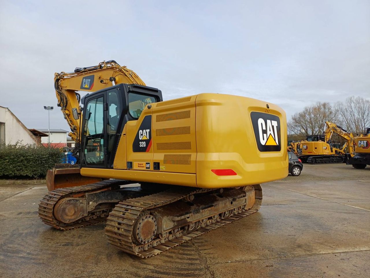 2019 Caterpillar 320 crawler excavator, rear three-quarter view