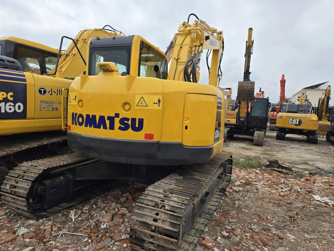 2023 Komatsu PC138US crawler excavator, rear three-quarter view 2023 Komatsu PC138US crawler excavator, rear three-quarter view