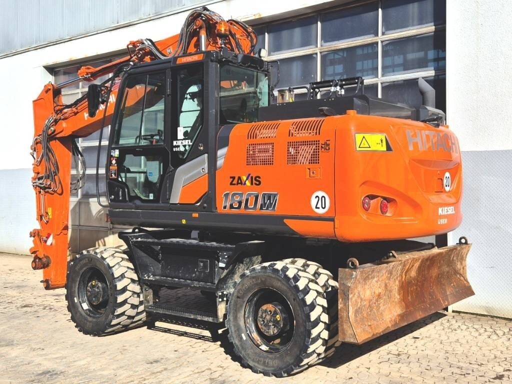 2024 Hitachi Zaxis 180W wheel excavator, rear three-quarter view 2024 Hitachi Zaxis 180W wheel excavator, rear three-quarter view