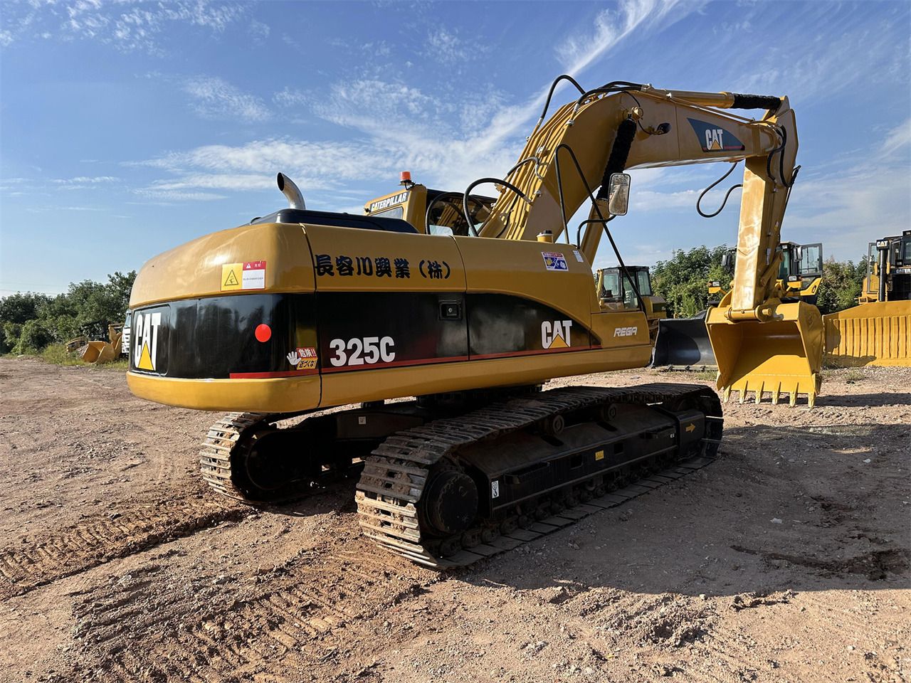 2018 Caterpillar 325C crawler excavator, rear three-quarter view