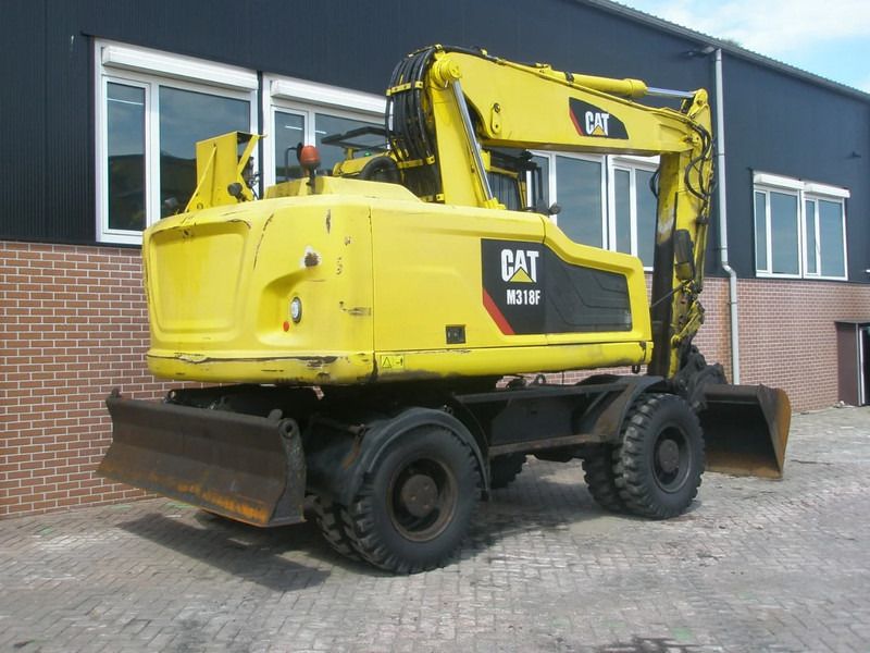 2017 Caterpillar M318F wheel excavator, rear three-quarter view 2017 Caterpillar M318F wheel excavator, rear three-quarter view