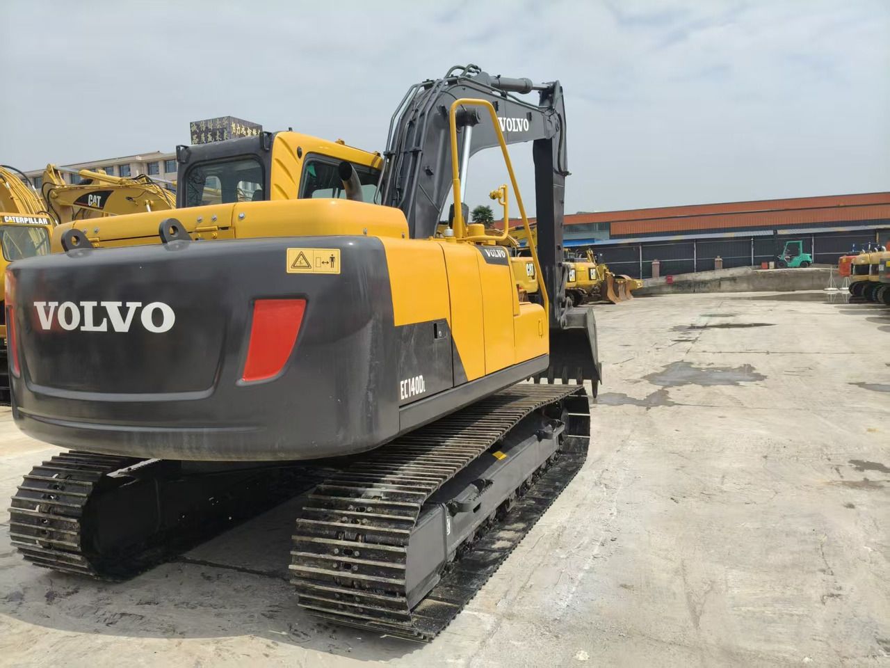 2023 Volvo EC140DL crawler excavator, rear three-quarter view 2023 Volvo EC140DL crawler excavator, rear three-quarter view
