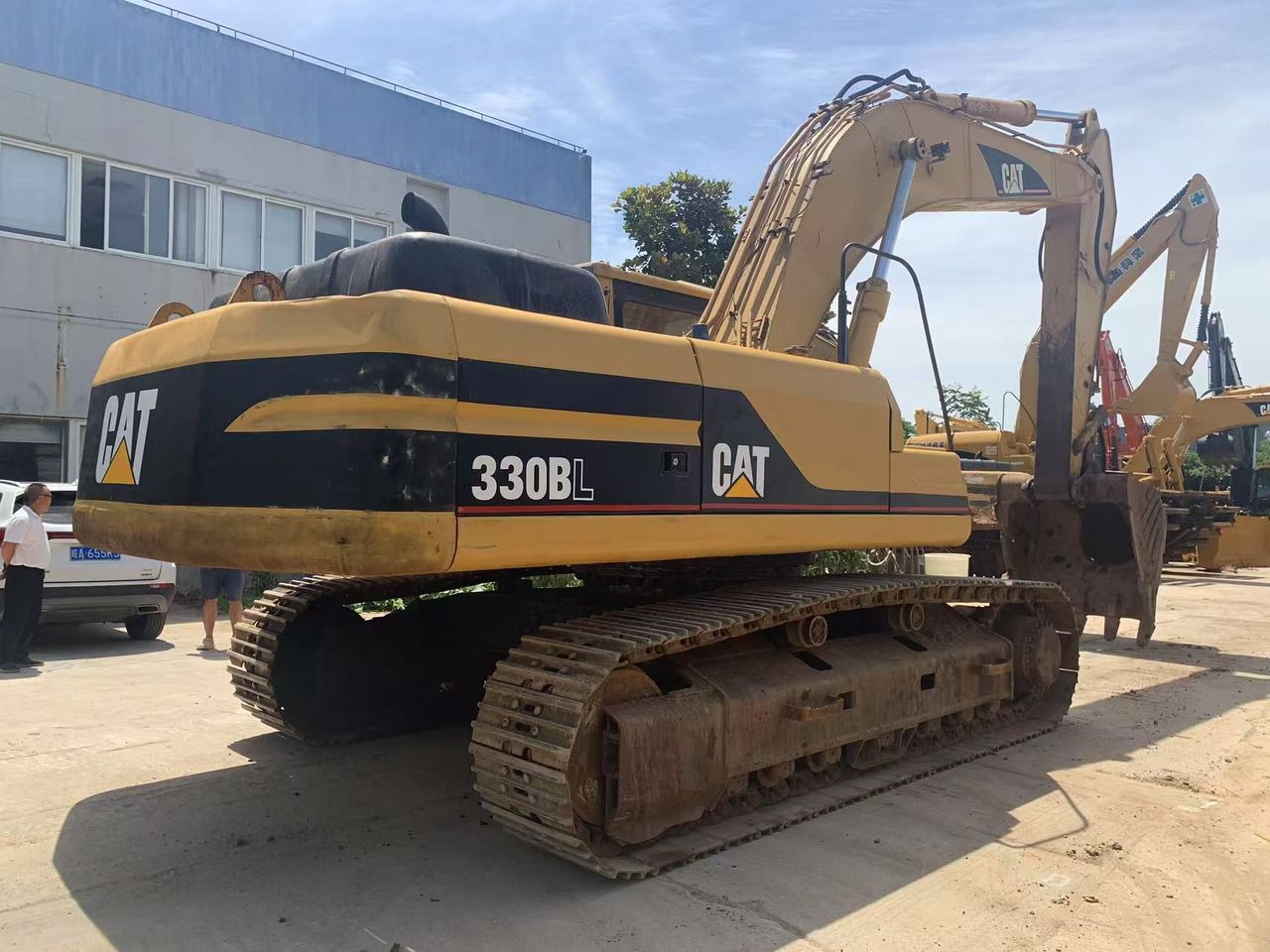 2018 Caterpillar 330BL crawler excavator, rear three-quarter view 2018 Caterpillar 330BL crawler excavator, rear three-quarter view