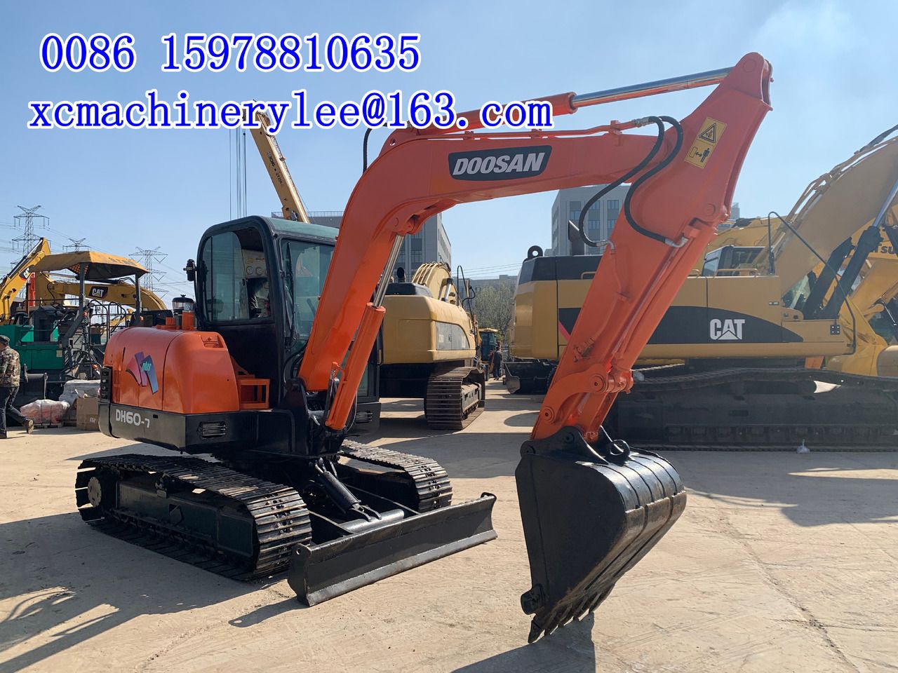 2023 MAN DX60 mini excavator, side view 2023 MAN DX60 mini excavator, side view