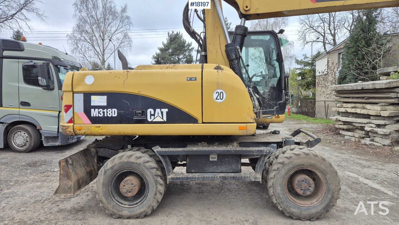 2010 Caterpillar M318D wheel excavator side view 2010 Caterpillar M318D wheel excavator side view