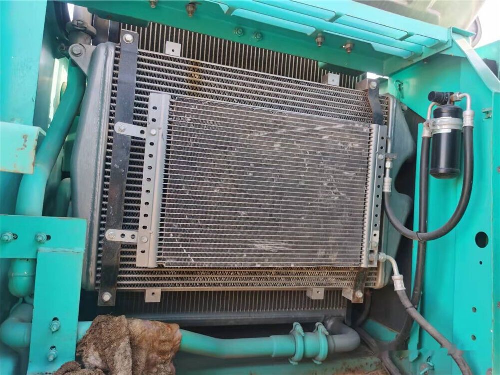 Kobelco SK210 crawler excavator engine compartment radiator view Kobelco SK210 crawler excavator engine compartment radiator view