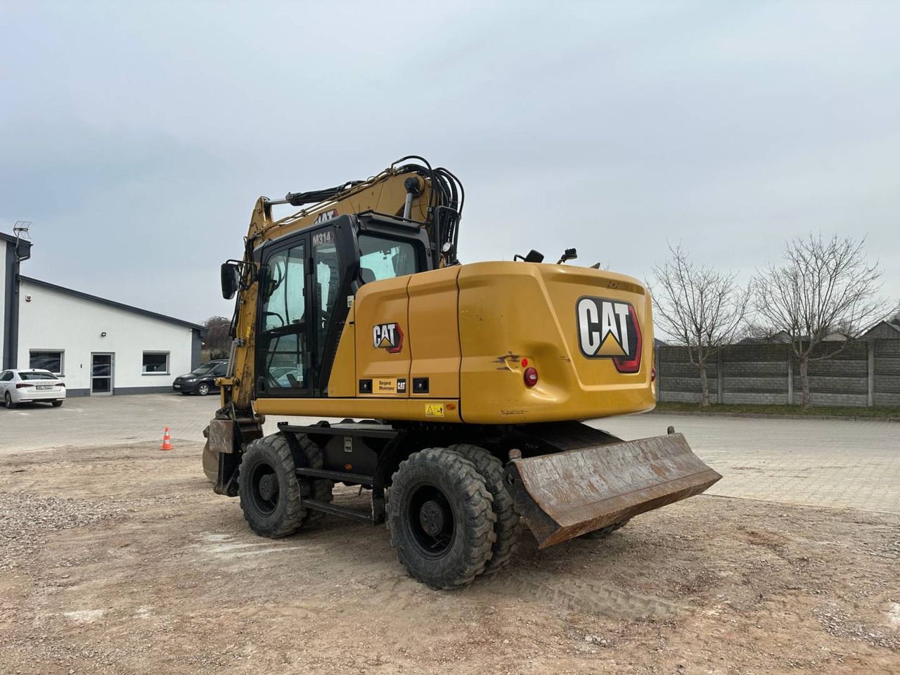 2021 Caterpillar M314 wheel excavator rear three-quarter view 2021 Caterpillar M314 wheel excavator rear three-quarter view