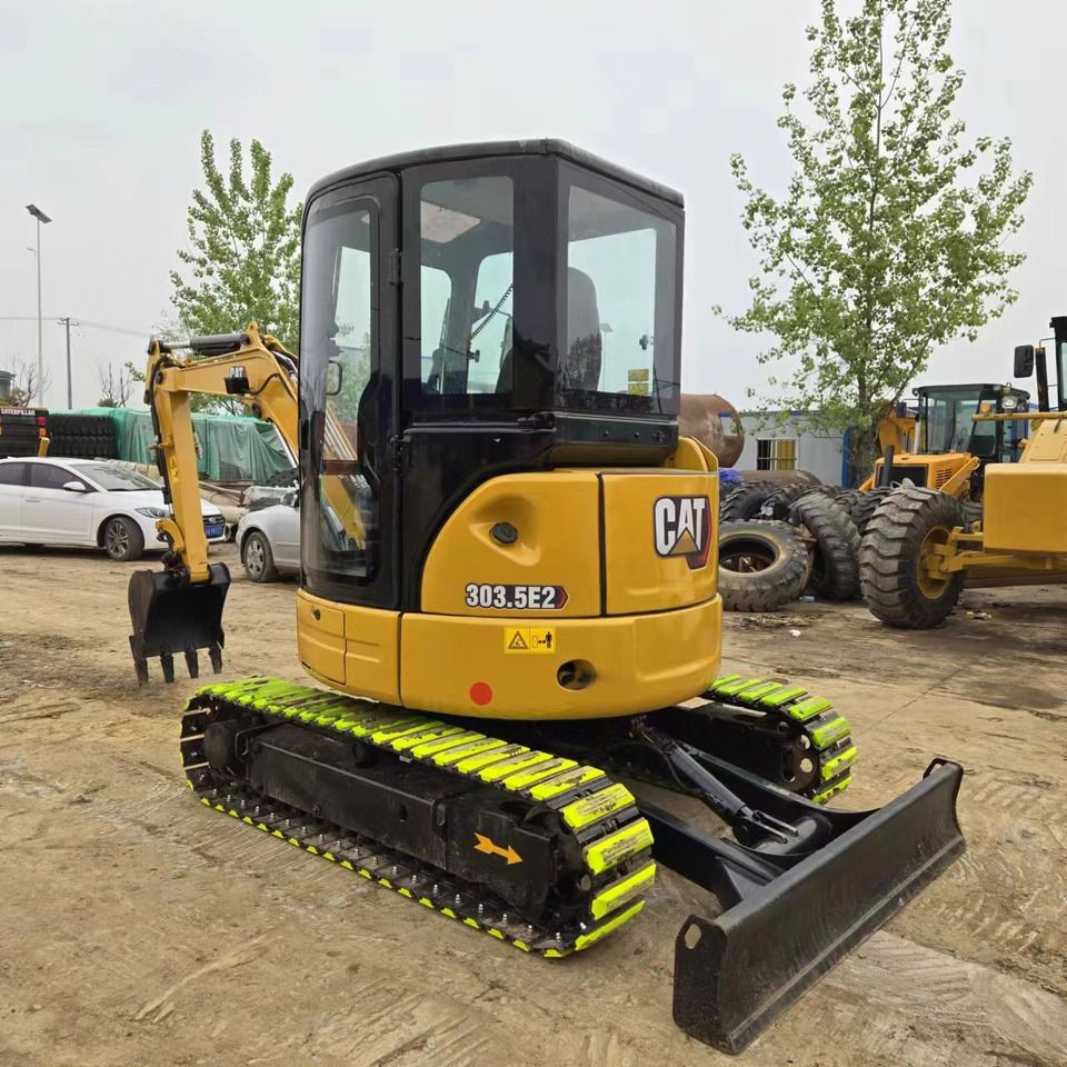 2023 Caterpillar 303.5E2 mini excavator, rear three-quarter view 2023 Caterpillar 303.5E2 mini excavator, rear three-quarter view