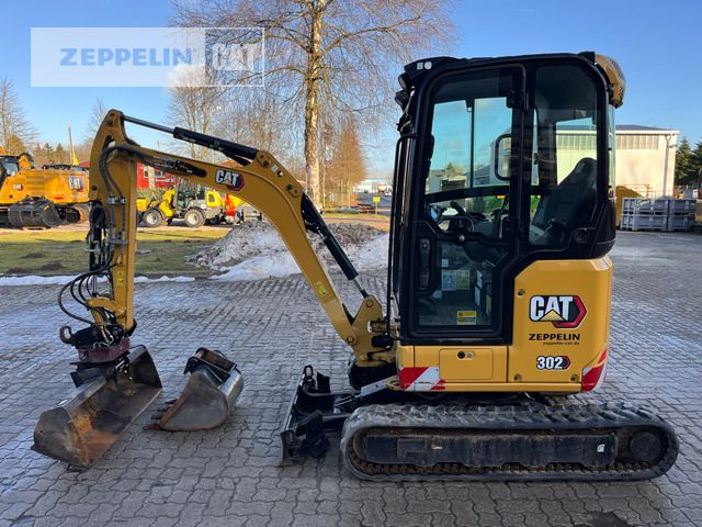 2022 Caterpillar 302-05A mini excavator, side view