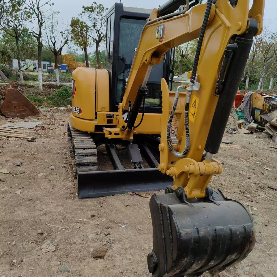 2023 Caterpillar 303.5E mini excavator, front three-quarter view 2023 Caterpillar 303.5E mini excavator, front three-quarter view