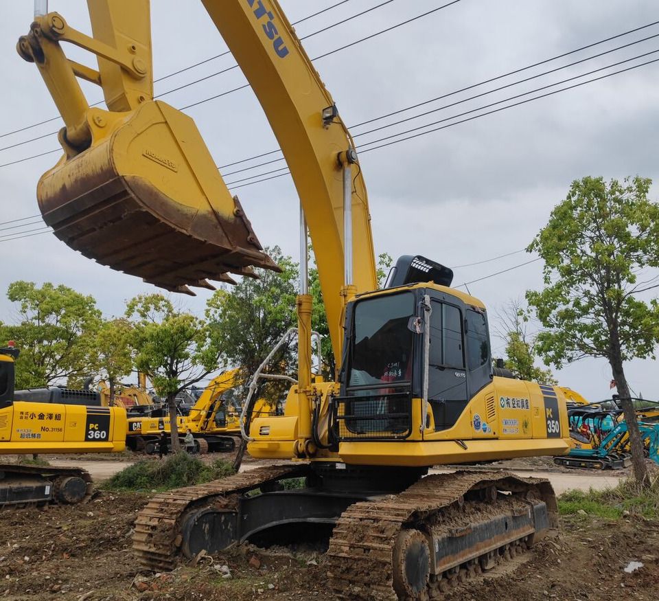 Komatsu PC350 crawler excavator, side view with raised bucket