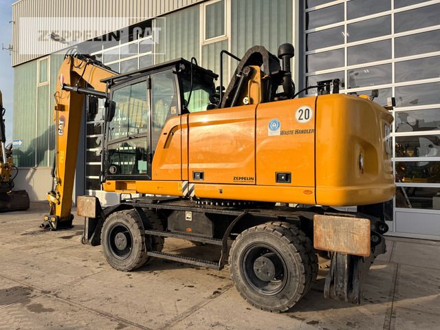 2020 Caterpillar MH3022-06C material handler side view 2020 Caterpillar MH3022-06C material handler side view