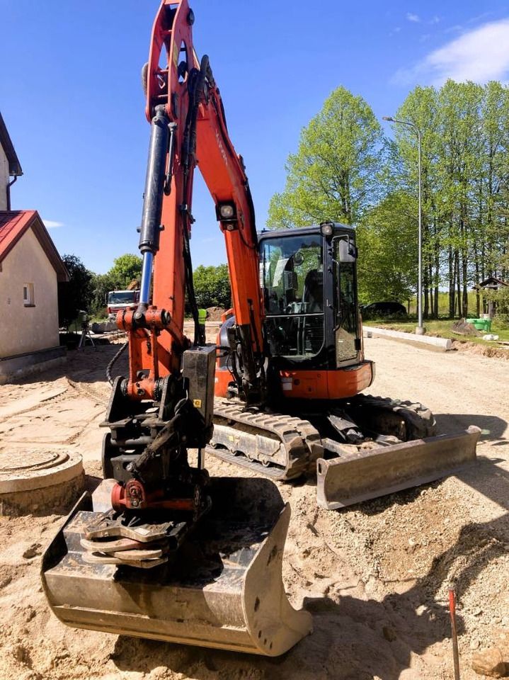 2020 Kubota KX057-4 mini excavator, front three-quarter view 2020 Kubota KX057-4 mini excavator, front three-quarter view