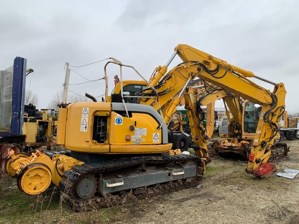 2006 New Holland E135SR-1ES crawler excavator, rear three-quarter view 2006 New Holland E135SR-1ES crawler excavator, rear three-quarter view