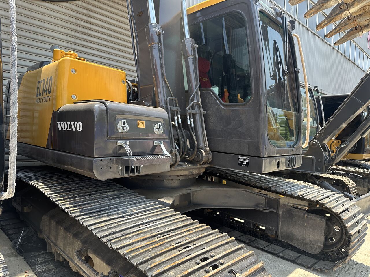 2023 Volvo EC140 crawler excavator, side view of cab and upper structure 2023 Volvo EC140 crawler excavator, side view of cab and upper structure