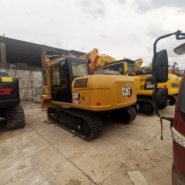 2021 Caterpillar 313D2 GC crawler excavator, rear three-quarter view 2021 Caterpillar 313D2 GC crawler excavator, rear three-quarter view
