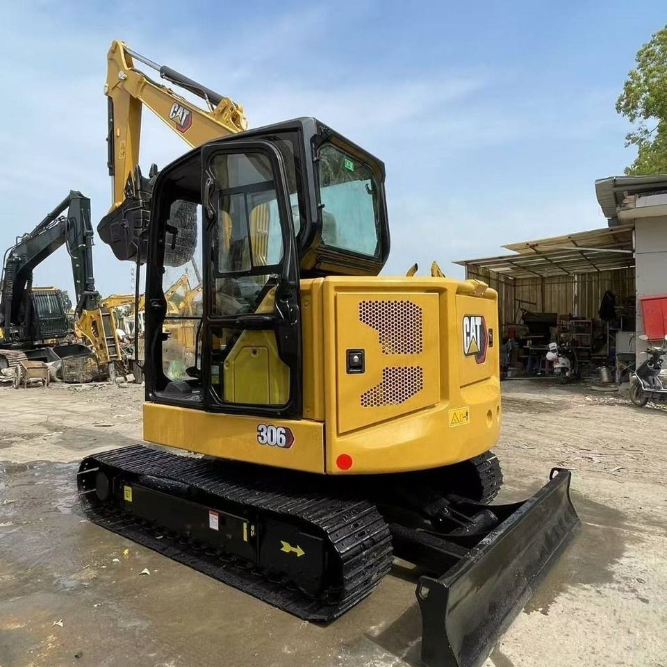 2024 Caterpillar 306 mini excavator, rear three-quarter view 2024 Caterpillar 306 mini excavator, rear three-quarter view