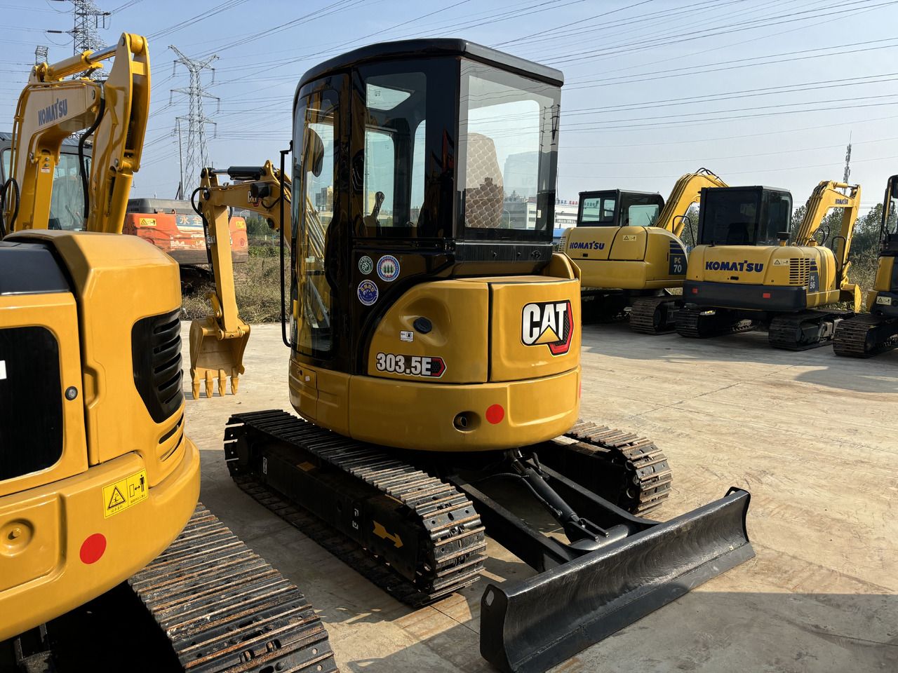 2023 Caterpillar 303.5E mini excavator, rear three-quarter view
