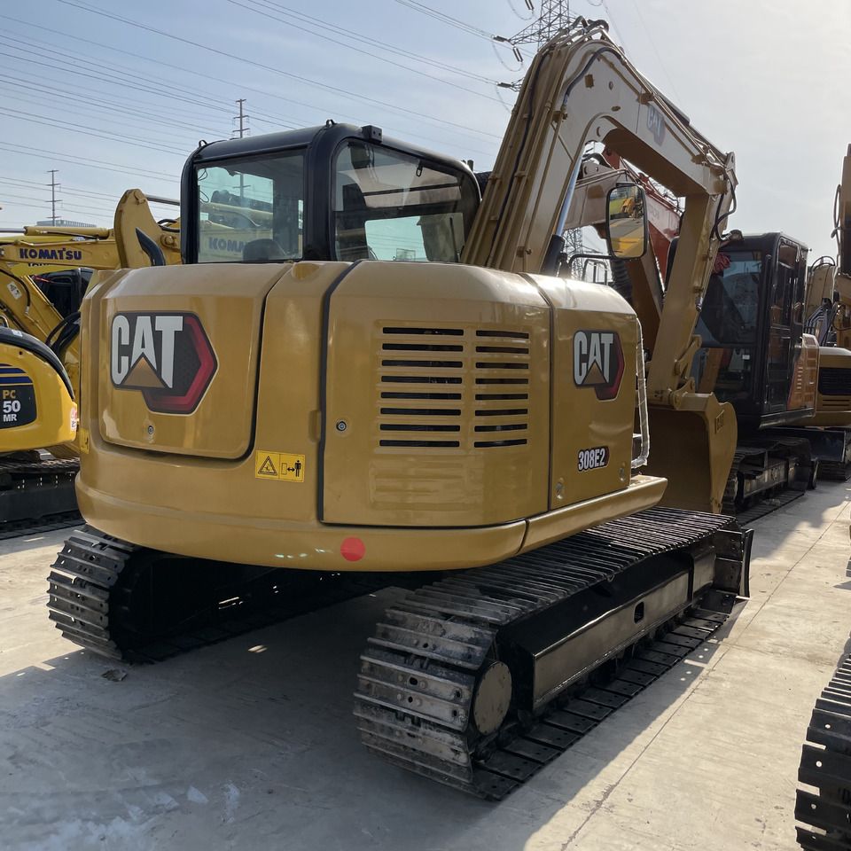 Caterpillar 308E2 mini excavator, rear three-quarter view