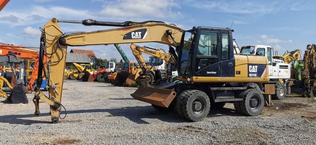 2011 Caterpillar M315D wheel excavator, side profile view