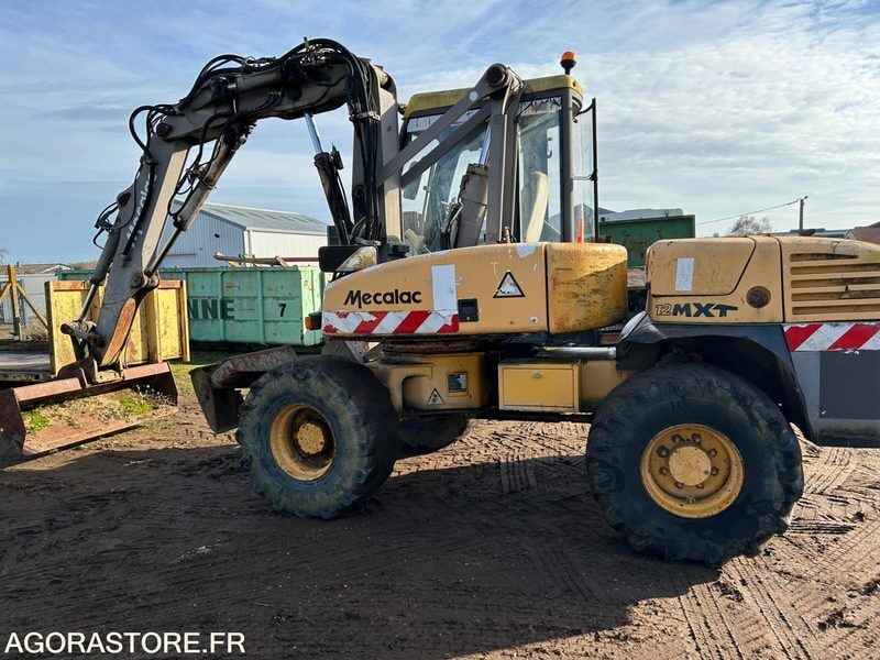 2002 Mecalac 12MXT wheel excavator, side view 2002 Mecalac 12MXT wheel excavator, side view