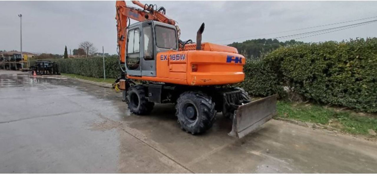 2002 New Holland EX165W wheel excavator, rear three-quarter view 2002 New Holland EX165W wheel excavator, rear three-quarter view