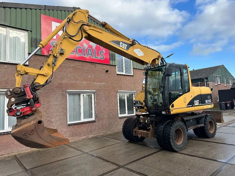 2003 Caterpillar M315C wheel excavator, side view 2003 Caterpillar M315C wheel excavator, side view